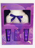 The Luxury Bathing Company Lavender Dreams Cosy Up gift set includes lavender-scented body cream, hand cream, and bath caviar paired with a white hot water bottle