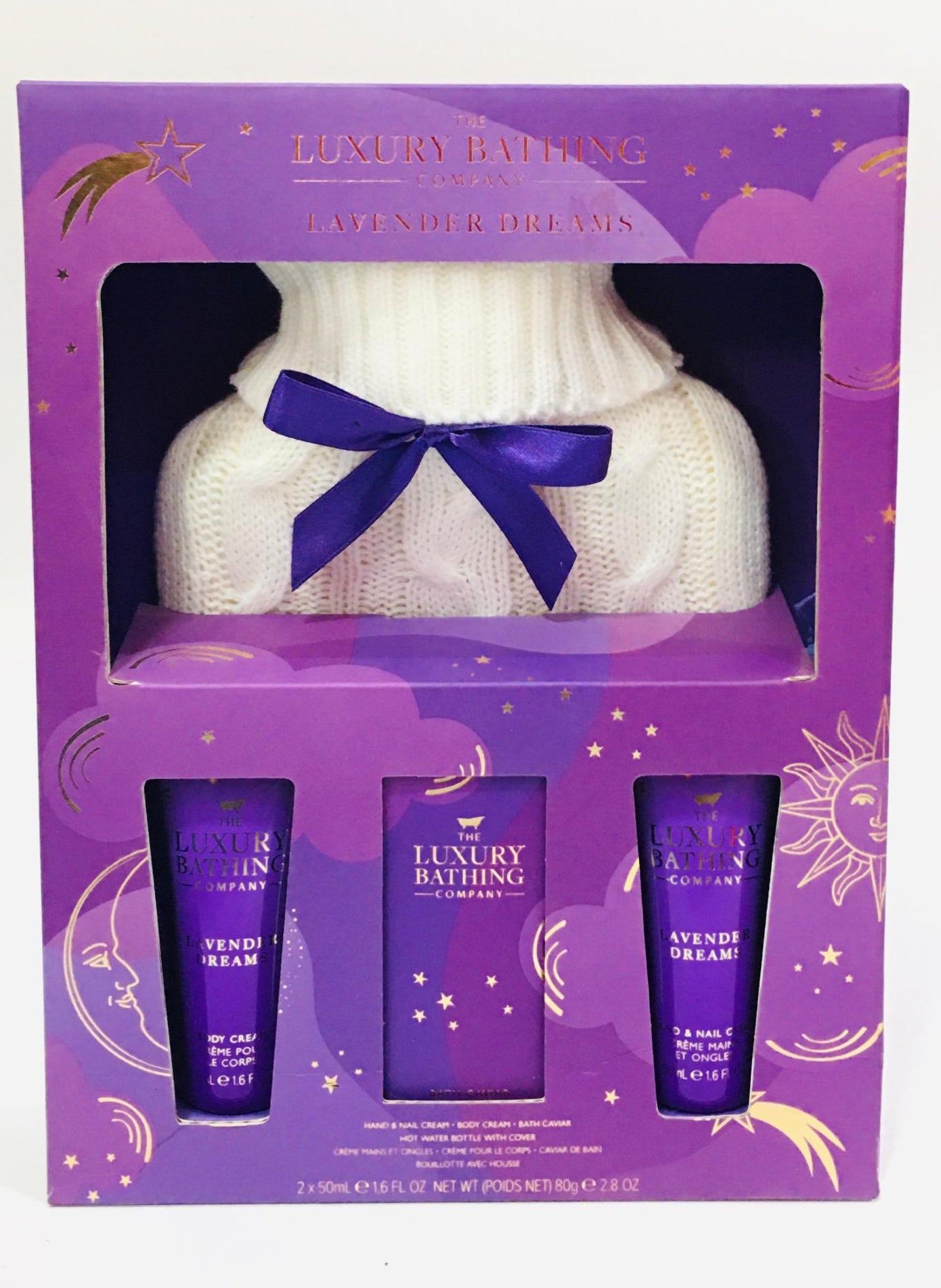 The Luxury Bathing Company Lavender Dreams Cosy Up gift set includes lavender-scented body cream, hand cream, and bath caviar paired with a white hot water bottle