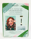 Danielle Creations L.E.D. mirror set, which includes an illuminating vanity mirror, a dual-sided jade facial roller, and a plush headband.