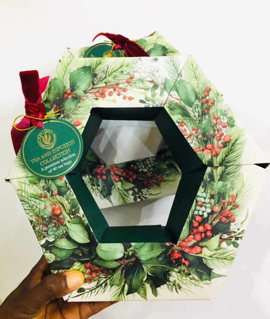 Premium selection tea and infusion collection set packaged in a hexagonal holiday-themed box.