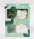 Wanderflower Jade Facial Roller & Headband set includes a dual-ended stone roller and a plush headband for skincare routines.